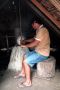 Amazonas06 - 065 * When enough rubber has been collected, it is slowly built up into a ball by twirling it over a smokey fire. Carbon sets the liquid rubber into a solid.
